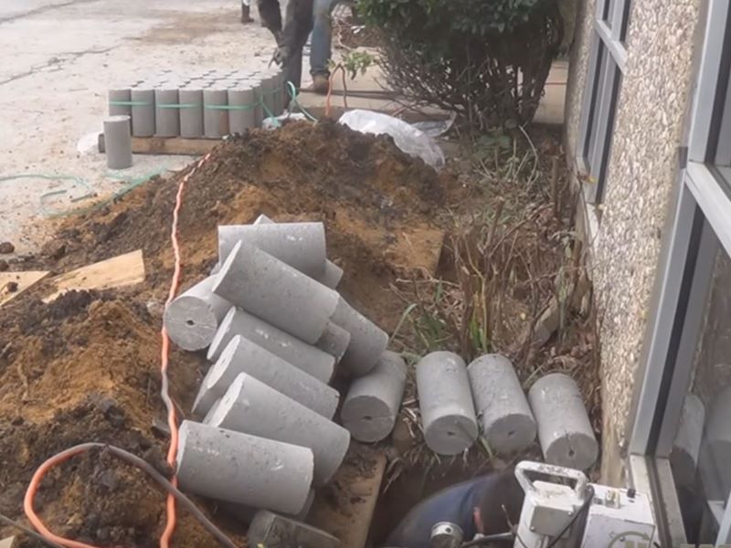 cement rolls beside the house